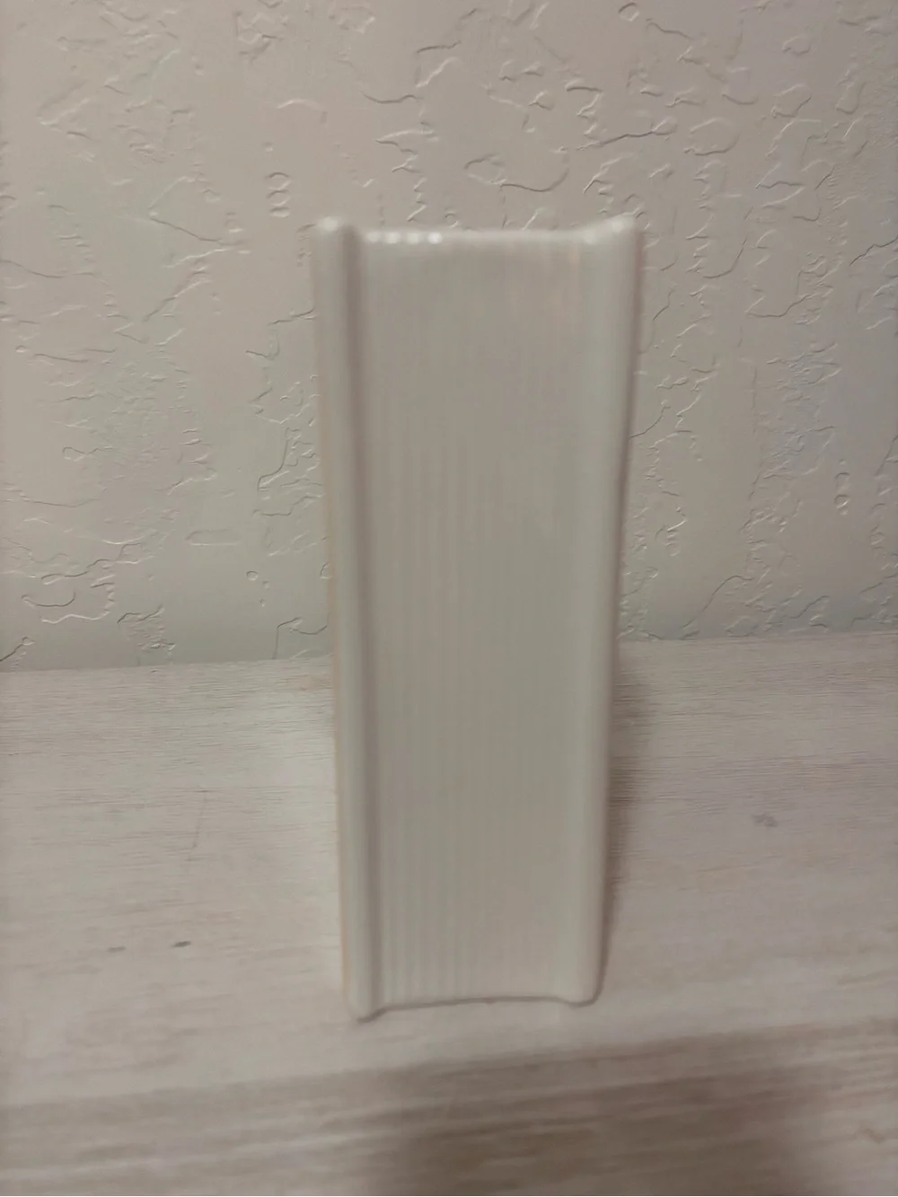 Anne of Green Gables book vase. ceramic book vase with vertical ribbed texture.